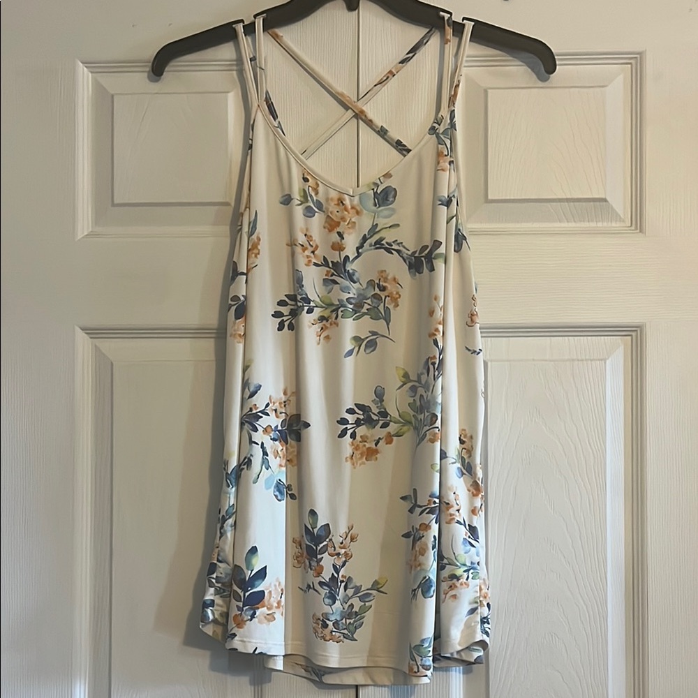 Cream backless camisole with spaghetti straps and relaxed v-neck